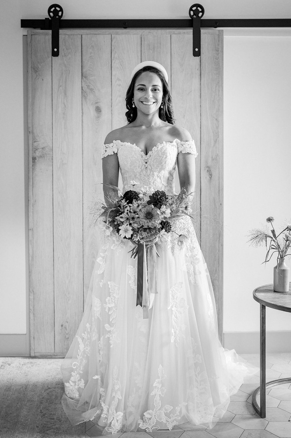 bride ready for her wedding ceremony wearing wedding dress at oak barn frame farm in kent